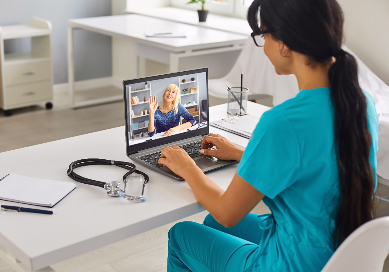 Doctor and patient engaging in a HIPAA-compliant telemedicine consultation, following telemedicine security tips.